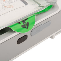 Pull green tab to release the pads to apply to the patient